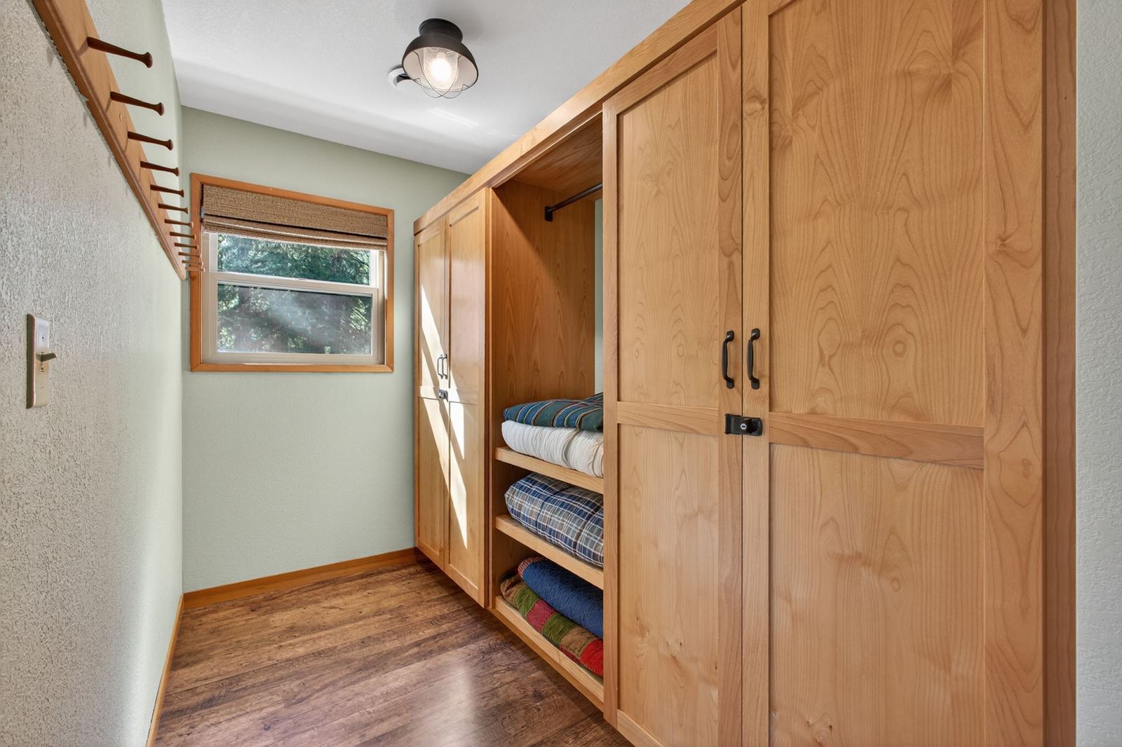 Built-in storage with extra bedding and blankets
