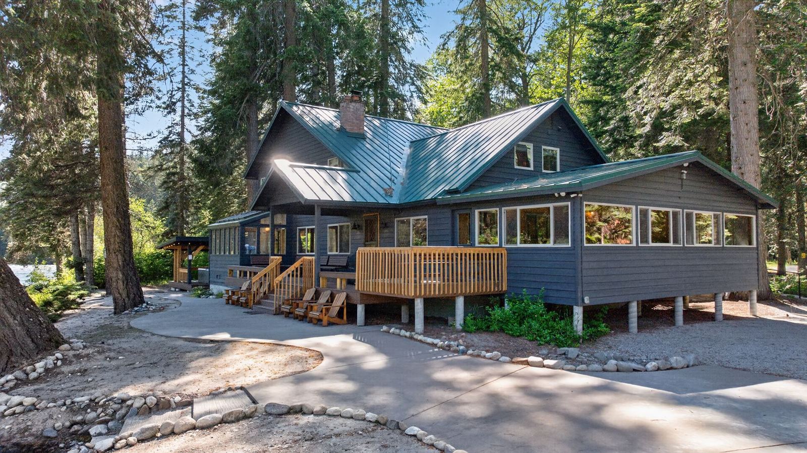 The lodge and its deck under the pines