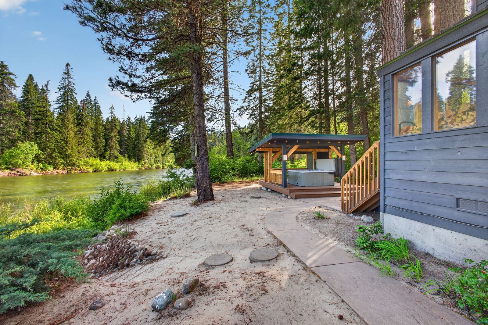 Path along the riverbank to the hot tub pavilion